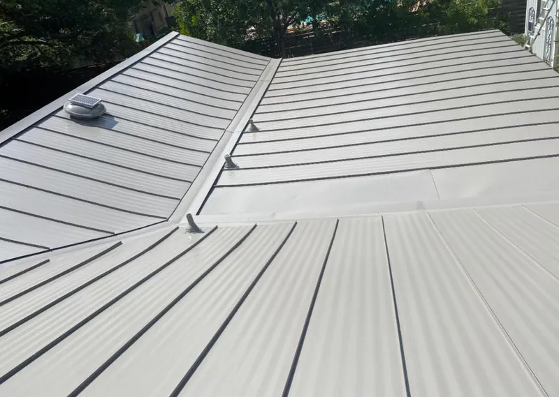 Solar attic fan installed on a metal roof for Roof Ventilation in Ranchettes
